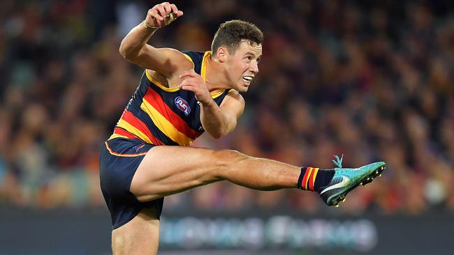 Adelaide’s Luke Brown kicks long.