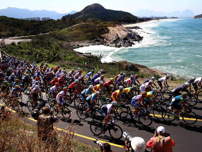 The peleton in action on the Grumari Loop during the Men's Road Race on day 1 of competition at the Rio Olympics. Picture: Adam Head