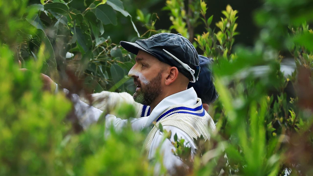 Nathan Lyon searches for a lost ball after Travis Head belted a six over the rope at the Cricket Central headquarters in Sydney Olympic Park. Picture: Mark Evans / Getty Images