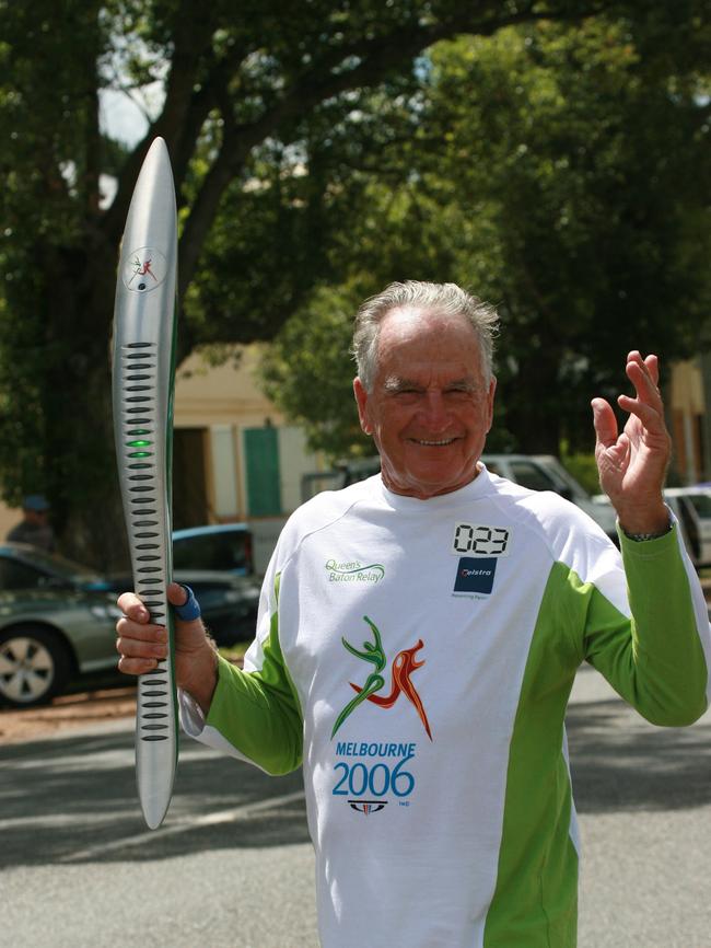 Harold Kratz runs the Olympic flame in 2000