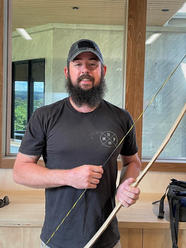 Troy McCandless with his finished longbow.