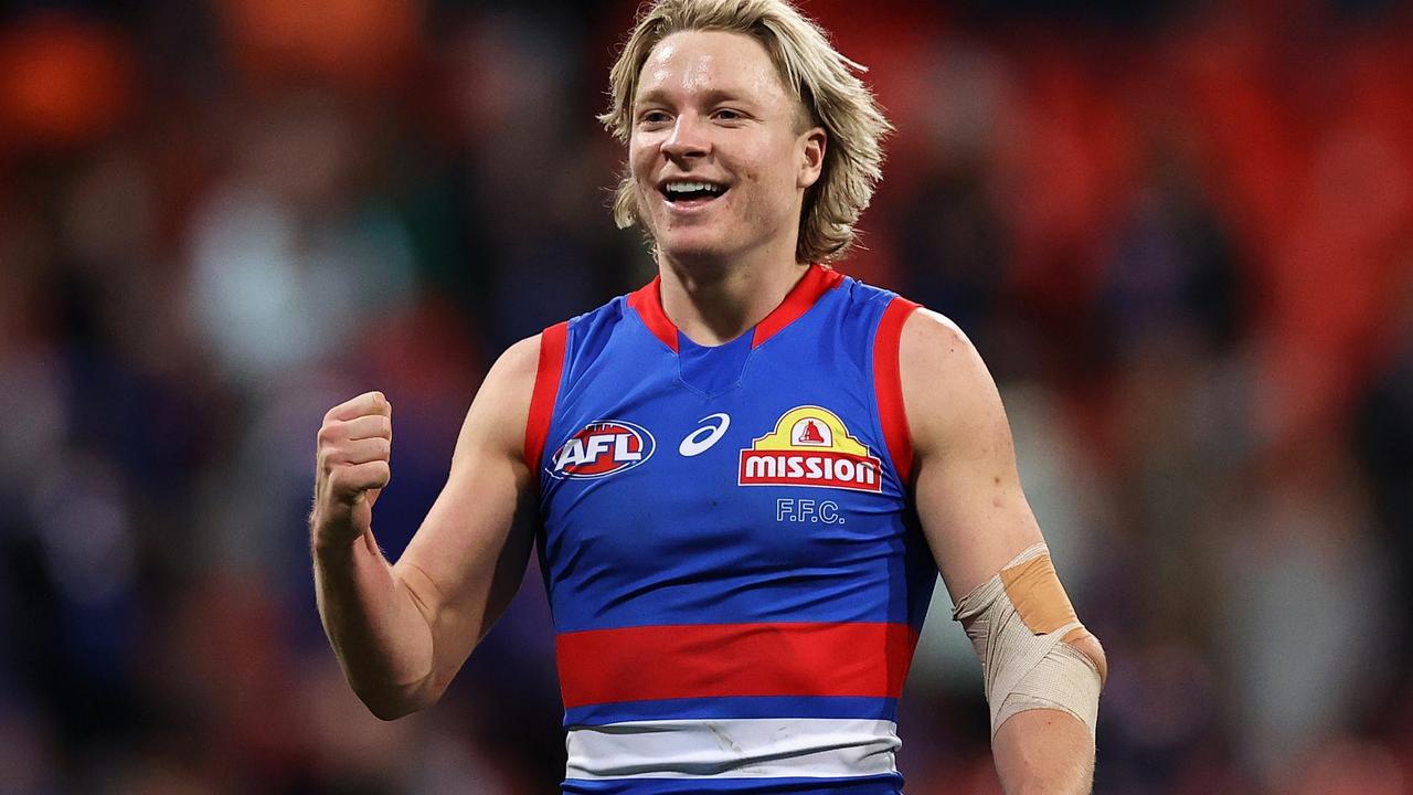 Weightman after returning to the ground with his elbow strapped celebrates winning at the end of the game. Picture: Cameron Spencer/Getty Images