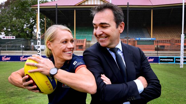 Premier Steven Marshall and Erin Phillips pose for a photo after the State Government announced its continued funding of the Adelaide Crows AFLW team at the Parade Oval Monday,December,3,2018.(Image AAP/Mark Brake)