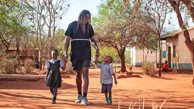 The footballer making two new fans. (Picture: Nick Ralph)