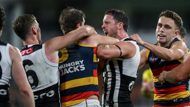 Tensions were high as Matt Crouch and Travis Boak fight after the Izak Rankine hit which saw Dan Houston slapped with a five week ban. Picture: Mark Brake