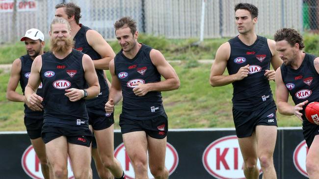 Jobe Watson leads his teammates out for training today. Picture: Hamish Blair