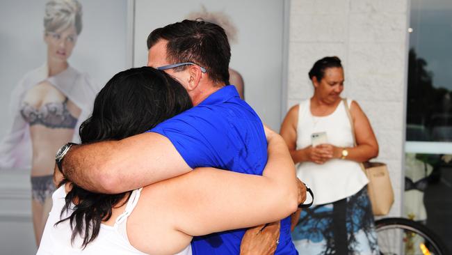 Minister Ken Vowles is seen hugging his wife and mother after a presser today. Picture: Keri Megelus