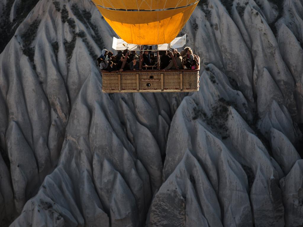 Tourists view rock formations during a hot air balloon tour on April 17, 2016 in Nevsehir, Cappadocia, Turkey. Picture: Getty