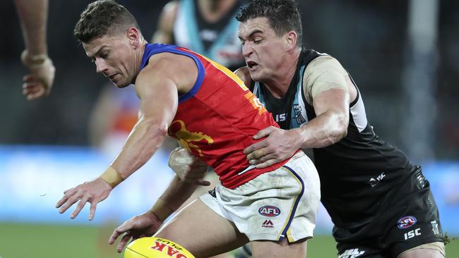 AFL – Port Adelaide v Brisbane Lions at Adelaide Oval. Dayne Zorko and Tom Rockliff. Picture SARAH REED