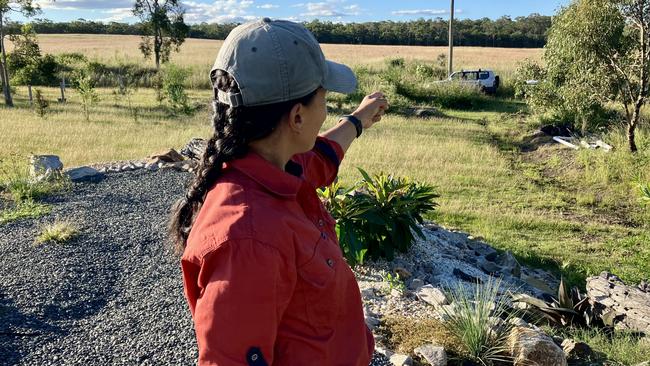 Ivonne Bowen pointing from her James Creek Rd property at the field.