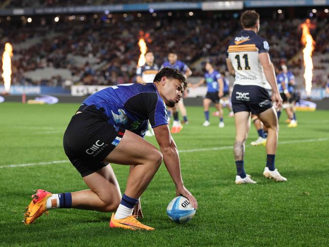 AJ Lam of the Blues scores for the Blues. Picture: Michael Bradley / AFP