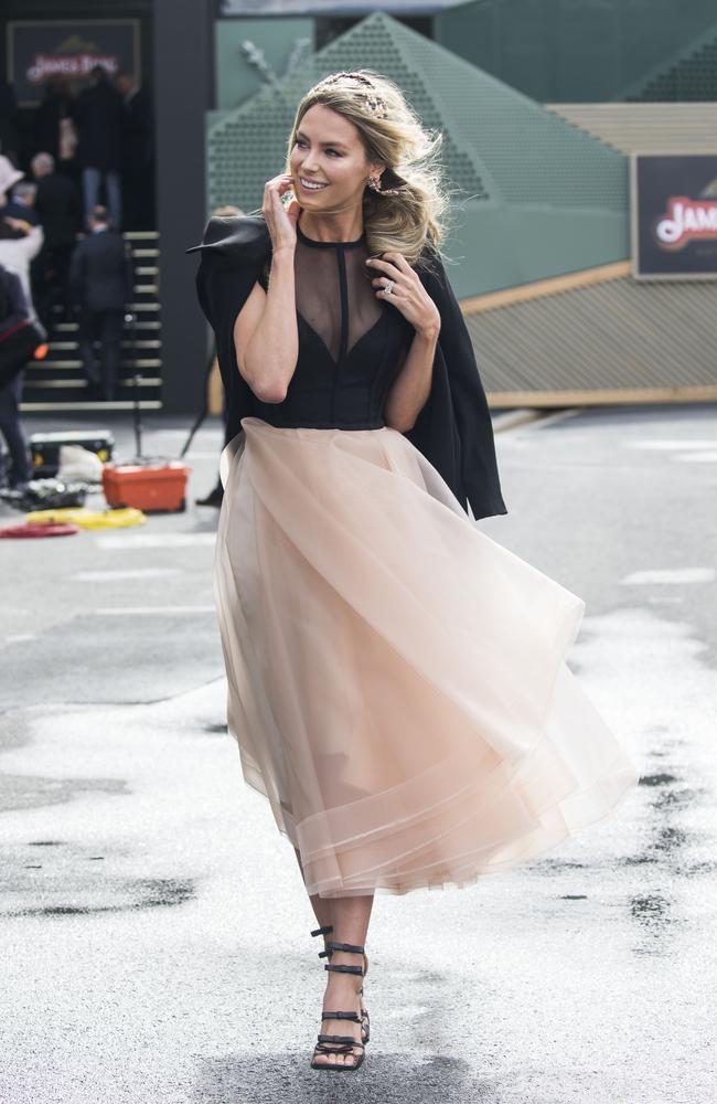 Jen Hawkins arrives at the very wet and windy Melbourne Cup. Picture: Media Mode