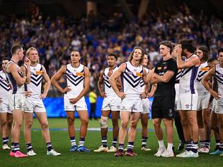 PERTH, AUSTRALIA - APRIL 20: The Dockers look dejected after the loss during the 2024 AFL Round 06 match between the West Coast Eagles and the Fremantle Dockers at Optus Stadium on April 20, 2024 in Perth, Australia. (Photo by Daniel Carson/AFL Photos via Getty Images)