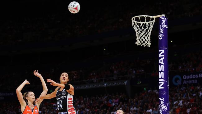 Jo Harten of the Giants shoots as Sharni Layton of the Magpies looks on. Picture: Brett Costello