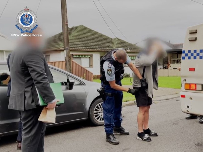 Ibrahim Hawat, Zaman Haidary, and Ashraf Khoder are before the courts for allegedly claiming more than $1.3 million in fraudulent disaster payments. This photo is of the arrest at Chester Hill on March 31, 2022. Picture: NSW Police