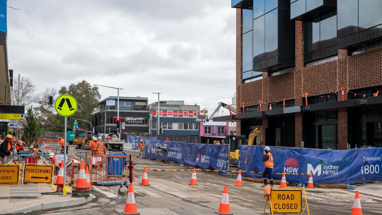 Construction workers still working on Crowns Nest Metro surroundings on Sunday. Picture Thomas Lisson