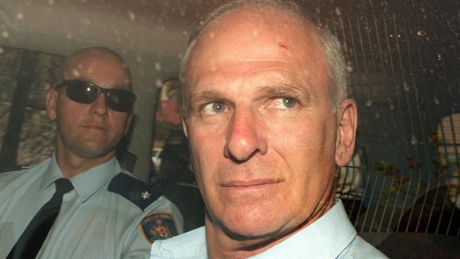 Criminal Arthur (Neddy) Smith guarded by correctional officers as they leave Supreme Court in Sydney, after he was acquitted of the murder of Sallie-Anne Huckstepp.