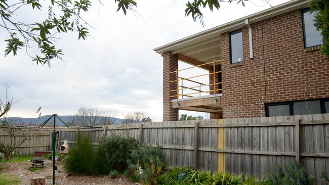 The large balcony overlooks the Drewett family’s backyard and looks into their lounge and kitchen.