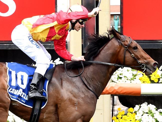 Ben Melham (red/yellow cap) wins on Malaguerra in the Lavazza Short Black. 2015 Melbourne Cup Day at Flemington Racecourse, Melbourne. MelbourneCup15 Picture: Nicole Garmston