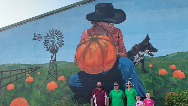 POSITIVE THOUGHTS: The Goomeri Pumpkin Festival team Gary Schneider (operations supervisor), Kim Boyter (co-ordinator), and Emma Schneider (secretary) with Lara and Maddy Schneider, who look forward to the 2021 event. Photo: Contributed