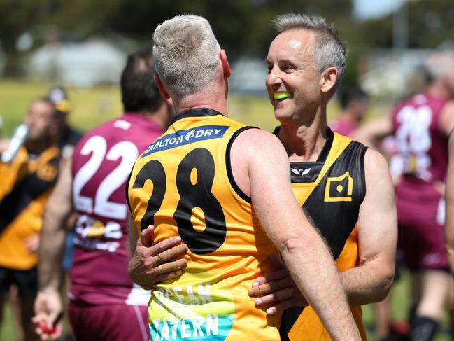 WA Over-50s players celebrate their win action from the AFL Masters National Carnival in Fremantle, WA. Picture: Ramiro Larguia