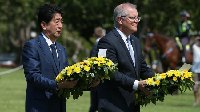 Japan's Prime Minister Shinzo Abe and Prime Minister Scott Morrison during a wreath laying ceremony at the Darwin Cenotaph in November 2018. Picture: AFP