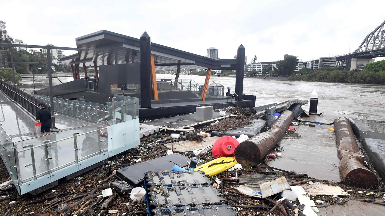 AFTER: Rubbish and debris comes crashed into a Ferry terminal at Howard Smith wharves following extraordinary weather in Brisbane. Picture, John Gass