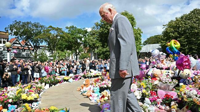 King Charles III reacts as he views tributes in Southport, where three girls were killed at a Taylor Swift dance club. Picture: AFP