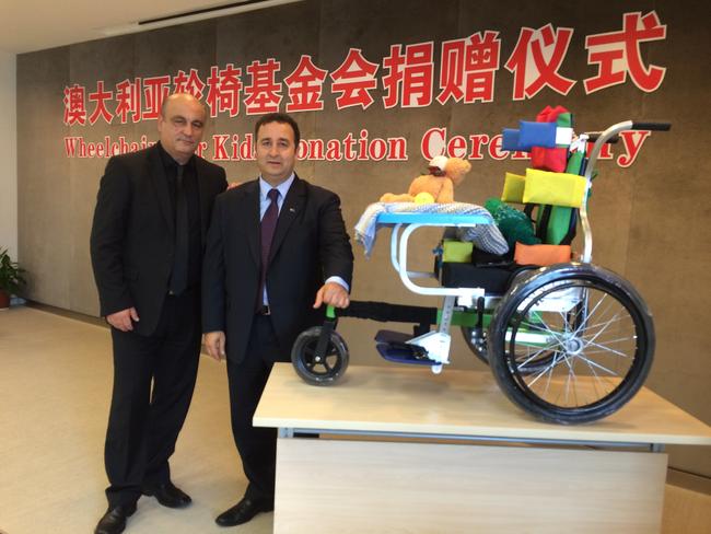 Mr Moselmane (right) with human rights activist Gerry Georgatos (left) on a trip to China raising money to facilitate wheelchairs being sent to disabled children. Picture supplied.