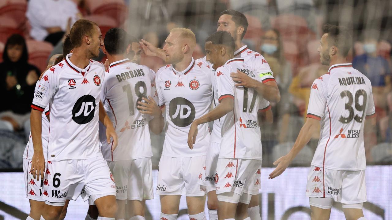 NEWCASTLE, AUSTRALIA - JANUARY 08: Tate Russell of the Wanderers celebrates his goal with teammates.