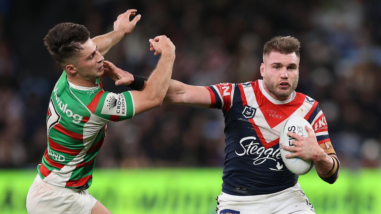 SYDNEY, AUSTRALIA - SEPTEMBER 02: Angus Crichton of the Roosters fends off Lachlan Ilias of the Rabbitohs during the round 25 NRL match between the Sydney Roosters and the South Sydney Rabbitohs at Allianz Stadium on September 02, 2022, in Sydney, Australia. (Photo by Cameron Spencer/Getty Images)