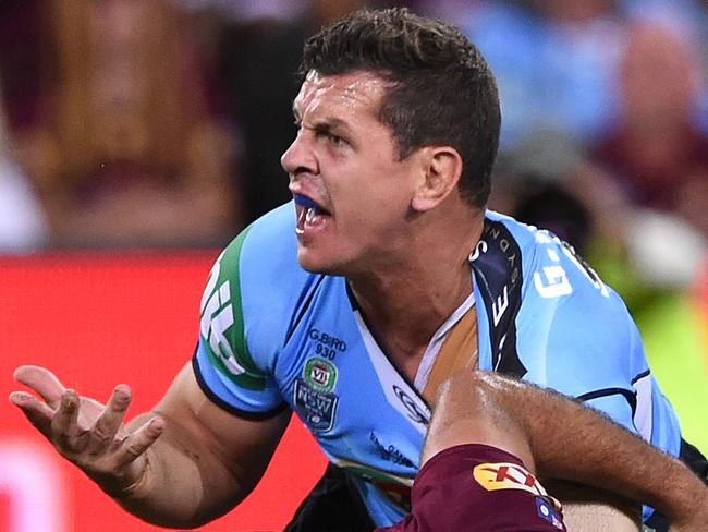 Blues player Greg Bird protests his knock-on during the State of Origin II between the Queensland Maroons and the New South Wales Blues at Suncorp Stadium in Brisbane, Wednesday June 22, 2016. (AAP Image/Dave Hunt) NO ARCHIVING, EDITORIAL USE ONLY