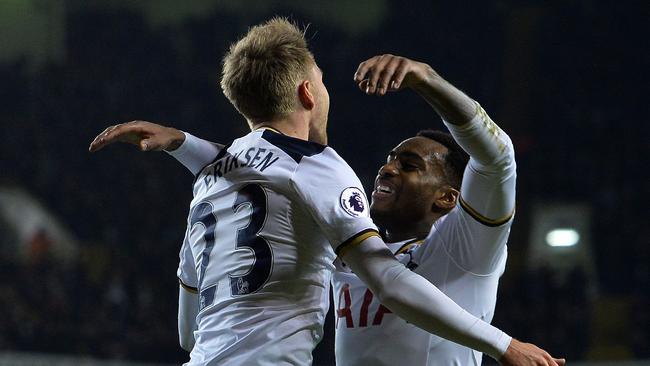 Tottenham Hotspur's Danish midfielder Christian Eriksen (L) celebrates.