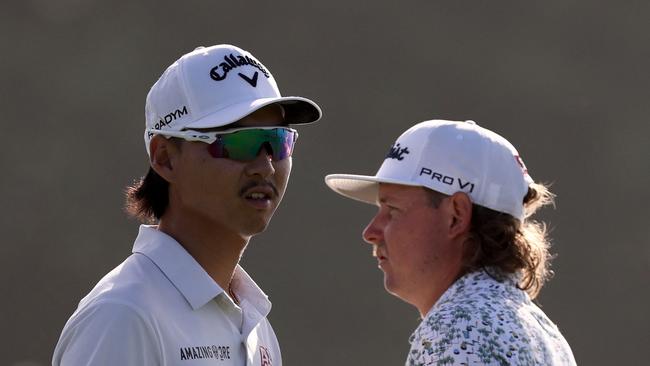 Min Woo Lee (L) opened his campaign with a five under par 67, while Cameron Smith (R) is in danger of missing a second consecutive cut. Picture: AFP.