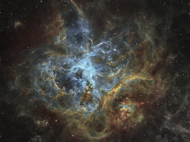 Insight Astronomy Photographer of the Year 2017 shortlist selection: Tarantula Colours . Picture: Diego Colonnello (Venezuela) The Tarantula Nebula or 30 Doradus is an H II region, or a region of interstellar atomic hydrogen that has been ionized, that is found in the Large Magellanic Cloud. Although it is about 160,000 light years away, the Tarantula Nebula has an apparent magnitude of 8, meaning that is an extremely luminous object, and if it were as close to our planet as the Orion Nebula is, it would actually cast visible shadows. Airport West, Victoria, Australia, 10 February 2017