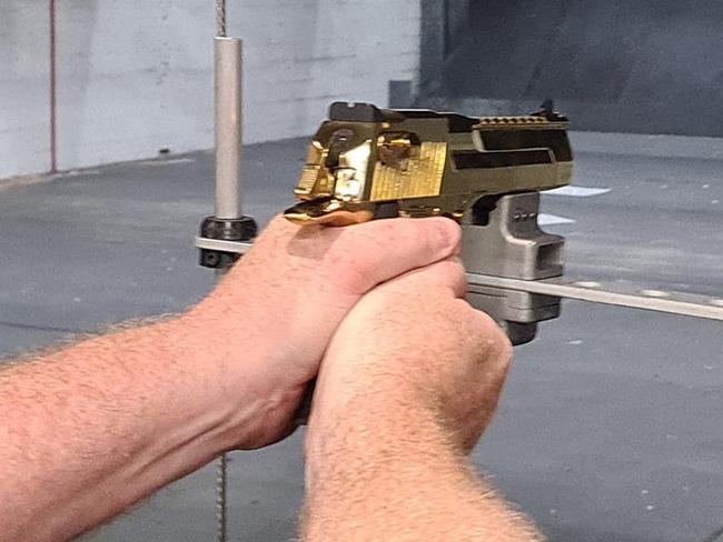 A customer shoots at the newly opened Gold Coast Indoor Shooting Centre. The public shooting gallery is on the same premises as the Southport Indoor Pistol Club at 76 Ferry Rd, Southport on the Gold Coast: Picture: Jodie Munro O'Brien** This photo has been flipped from its original**