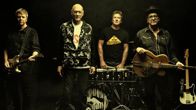 Midnight Oil (from left) Martin Rotsey, Peter Garrett, Rob Hirst, Jim Moginie and the bass guitar of the late Bones Hillman