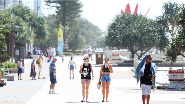 The iconic tourist hotspot of Surfers Paradise beach was quieter than usual but locals continue to venture out despite government warnings. Picture: Nigel Hallett.