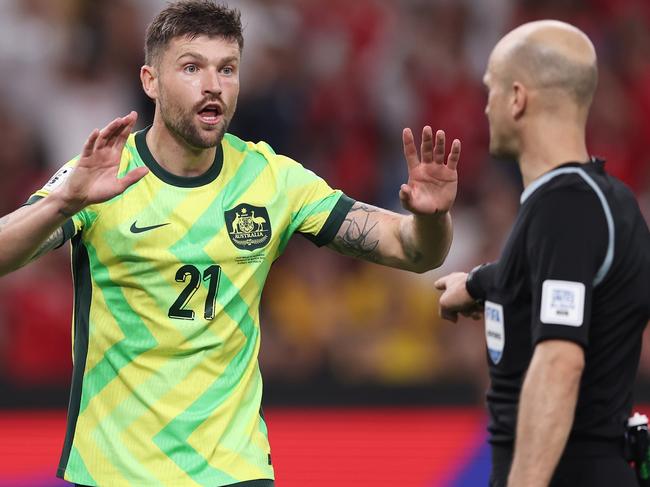 SYDNEY, AUSTRALIA - MARCH 20:  Cameron Burgess of Australia argues with the referee after a penalty was given to Indonesia during the round three FIFA 2026 World Cup AFC Asian Qualifier match between Australia Socceroos and Indonesia at Allianz Stadium on March 20, 2025 in Sydney, Australia. (Photo by Matt King/Getty Images)