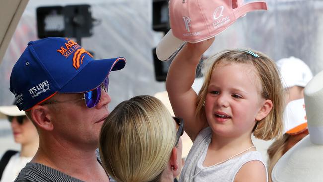 Royal Zara Phillips (obscured) with husband Mike Tindall with daughter Mia — Tindall says Mia is loving their third trip to Magic Millions on the sunny Gold Coast and is “in the water all day long”. Picture: NIGEL HALLETT