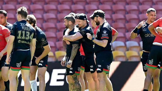 BRISBANE, AUSTRALIA – OCTOBER 02: Damien Cook embraces Adam Reynolds during a South Sydney Rabbitohs training session ahead of the 2021 NRL Grand Final at Suncorp Stadium on October 02, 2021 in Brisbane, Australia. (Photo by Bradley Kanaris/Getty Images)