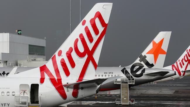 SYDNEY, AUSTRALIA - NewsWire Photos JUNE 28, 2021: Virgin and Jetstar Planes seen at Domestic Airport Terminal during the current Covid-19 Lockdown, Sydney Australia. Picture: NCA NewsWire / Gaye Gerard