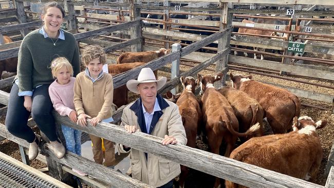 Abbie Cameron and children Lucy and Hugo, with their grandfather Clyde Lawrence, Karingal, Casterton, who sold seven light steers, 209kg, for one of the highest cents-per-kilogram rates paid in a Victorian saleyard, 644c/kg. Picture: Kate Dowler