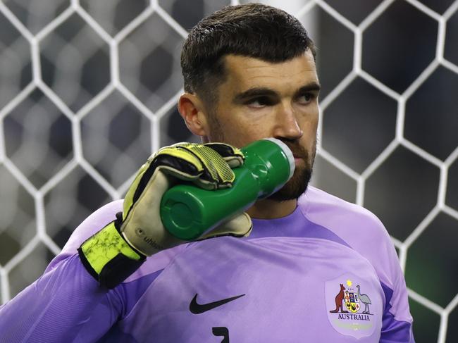 ARLINGTON, TEXAS - SEPTEMBER 9: Mat Ryan #1 of Australia hydrates during a pause in the action against Mexico during the second half of a 2023 International Friendly match at AT&T Stadium on September 9, 2023 in Arlington, Texas. (Photo by Ron Jenkins/Getty Images)