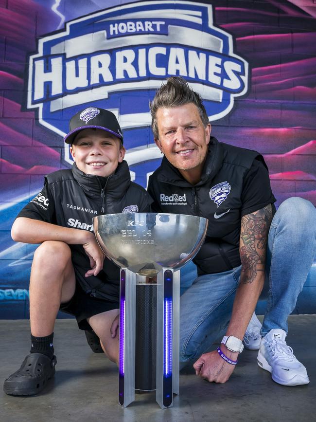 Charlie Meers, 9 and Shayne Wicks at Ninja Stadium with the BBL Trophy. Picture: Caroline Tan