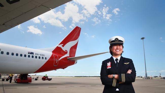 First Officer Boeing 737-800 Haidee Wong poses on the tarmac at Brisbane Airport. QANTAS is hosting the first of a series of training days for women, kicking off in Brisbane as it seeks to address a looming pilot shortage.Photo: Claudia Baxter