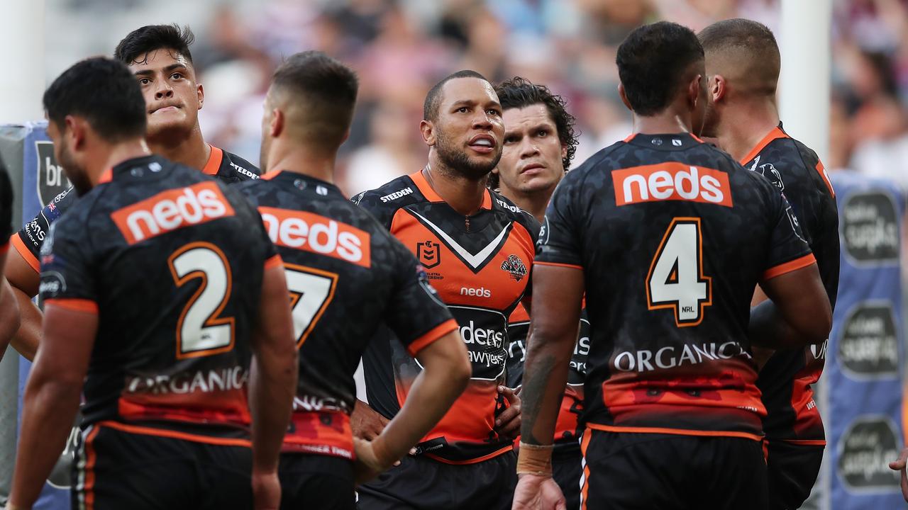 SYDNEY, AUSTRALIA - APRIL 25: Moses Mbye of the Tigers and teammates look dejected after a Sea Eagles try during the round seven NRL match between the Wests Tigers and the Manly Sea Eagles at Bankwest Stadium, on April 25, 2021, in Sydney, Australia. (Photo by Matt King/Getty Images)