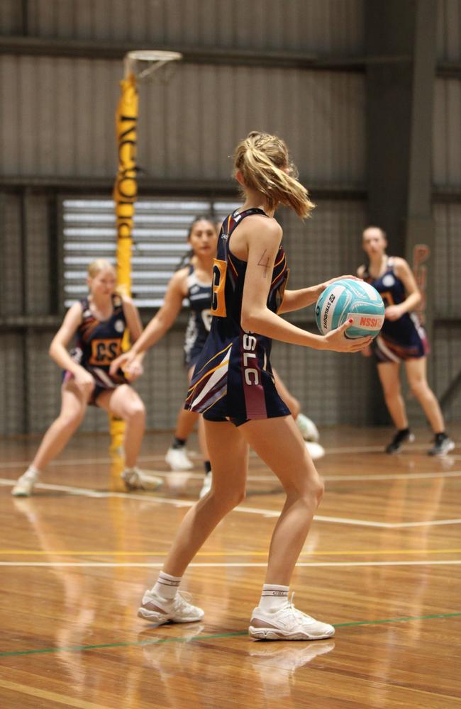 Netball action at QISSN 2024. Canterbury College v Good Shepherd Lutheran College