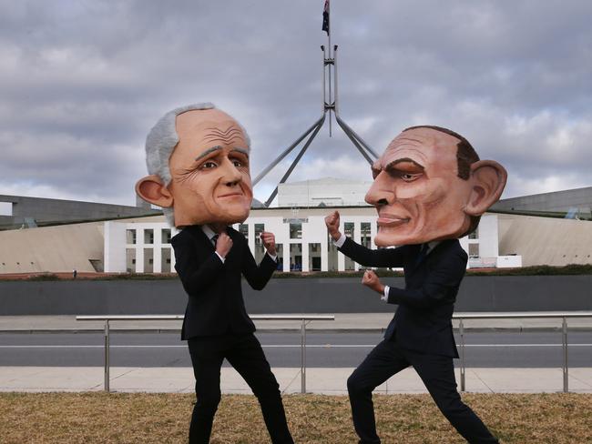 Two protesters wearing large heads of the Prime Minister Malcolm Turnbull and former Prime Minister Tony Abbott on the lawns of Parliament House in Canberra. Picture: Gary Ramage