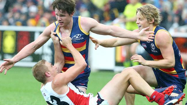 Vince does a tagging job on Patrick Dangerfield in 2015. Picture: Sarah Reed